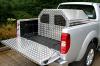 Previous Model of the 5 Bar Chequer plate Dog Kennel fitted to the back of a Toyota Hilux Pickup