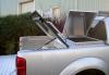 Photograph of the tonneau cover in its open position and the gull winged lid on a Nissan Navara D40 Pickup.