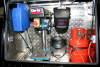 Side opening access to reveal drill, cable extender, and gas bottles.