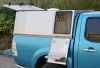 Side door shows step upo into kennel for easy access.