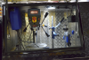 Stand drills fitted into side cupboards.