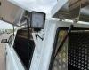 Close up of work light and open canopy doors
