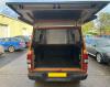 Extended rear door provides shelter while working