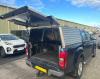Canopy with open extended door on Isuzu pickup