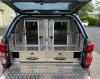 Rear view of shooting canopy with dog cage and drawers