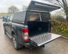 Solid Side Canopy with Open Doors shown on a Ford Ranger 