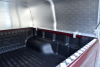Interior of the new Agrican shown without the Sliding bulkhead window and fitted over a plastic load liner with an Aluminium tailgate.