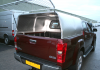 Mesh Tailgate lifts up on gas rams and has a locking tailgate with handle and key shown on a Isuzu 