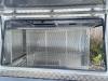 Side view of open gullwing door on bespoke canopy for Mitsubishi